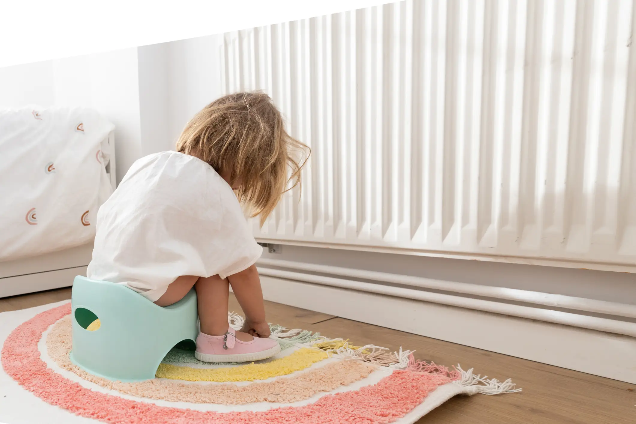 A toddler sitting on a potty (Getty Images)