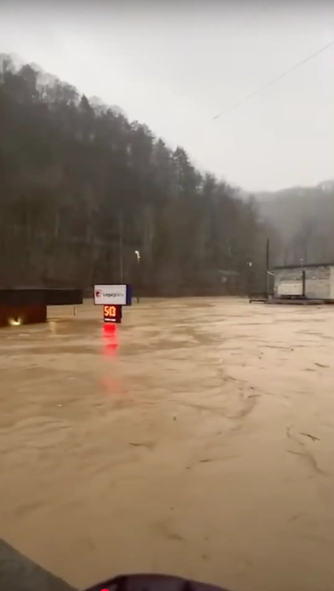 The top of a tall sign can only just be seen in Virginia (Samantha Broughton/CBS News/YouTube)