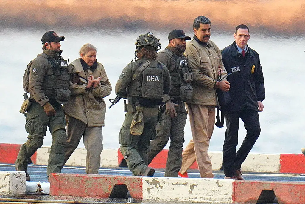 Nicolas Maduro and his wife, Cilia Flores, seen in handcuffs (XNY/Star Max/GC Images)