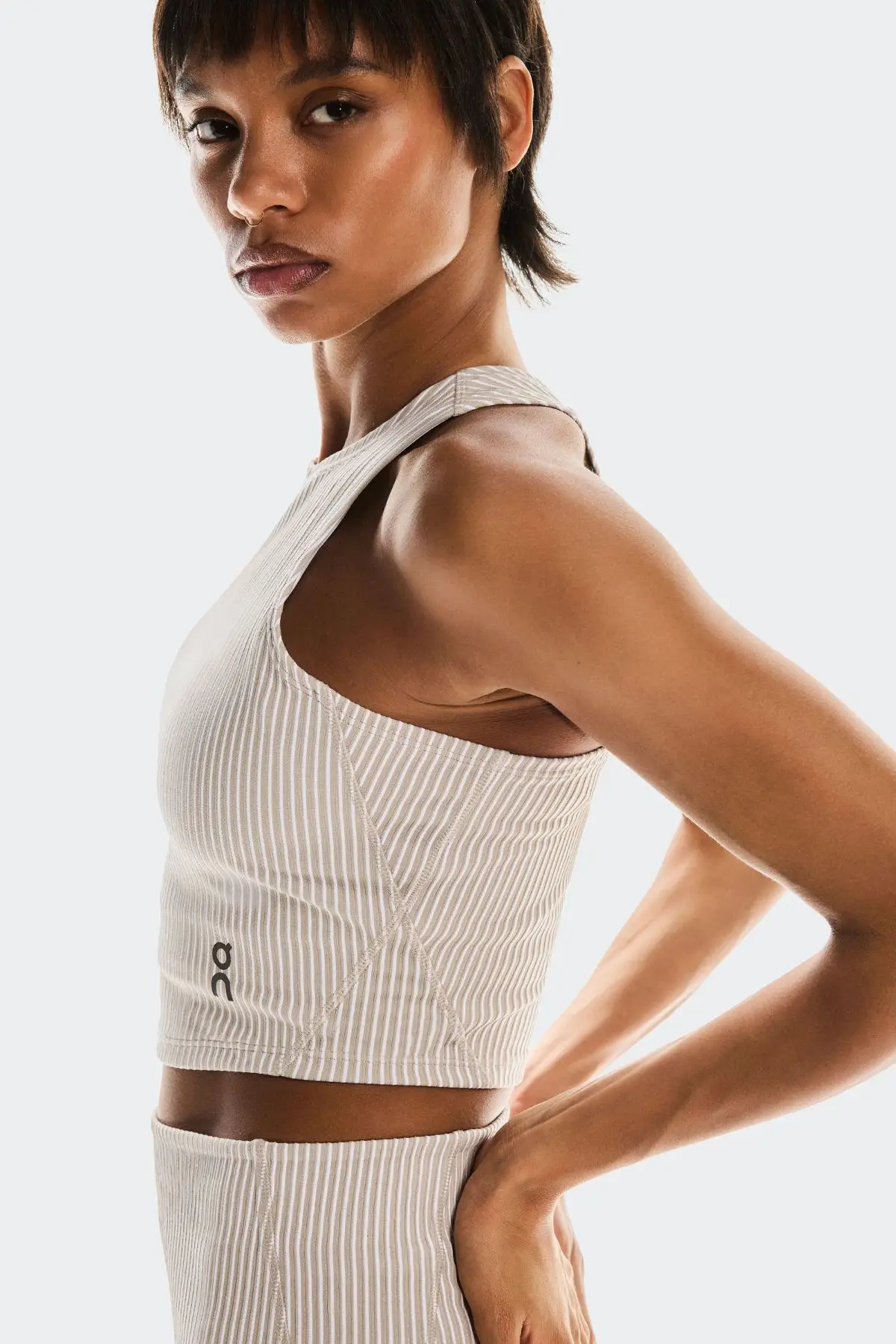 The All-Day Ribbed Crop Top styles perfectly alongside the matching pants and a pair on On sneakers (On)