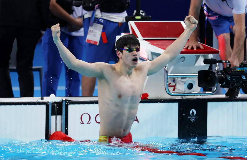 China's Zhanle Pan celebrates a gold medal in the men's 100m freestyle final. (Sarah Stier/Getty Images)
