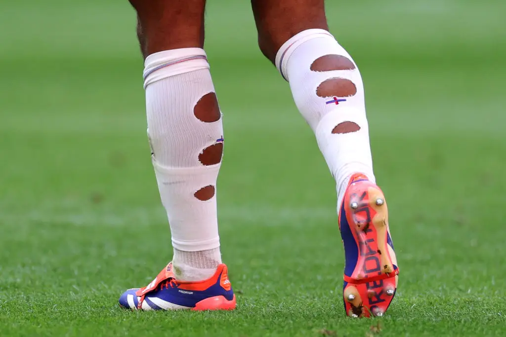 Some players also cut holes in their socks (Dean Mouhtaropoulos/Getty Images)