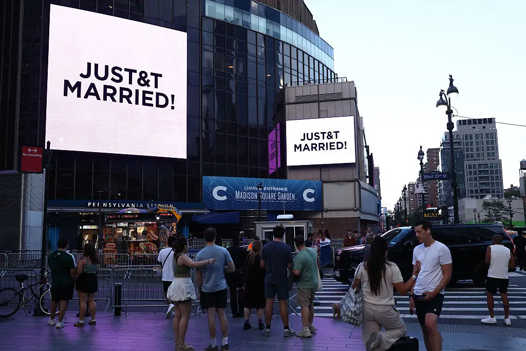 The couple announced they had tied the knot with a sign outside MSG (Photo by CHARLY TRIBALLEAU / AFP via Getty Images)