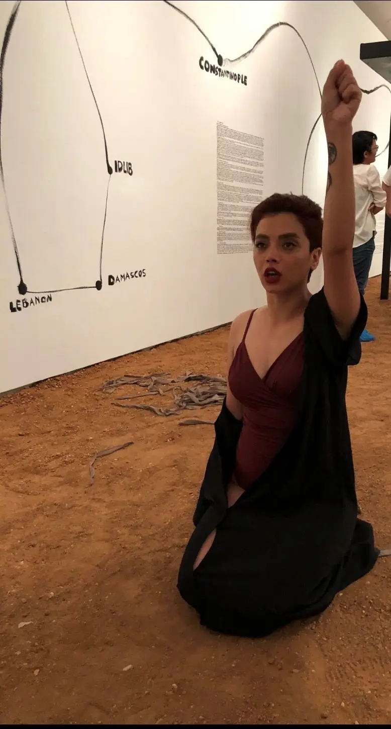 Leila gives a performance against compulsory head coverings for women.