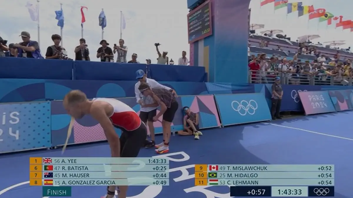 Canadian triathlete Tyler Mislawchuk violently threw up after the event. (BBC/NBC)