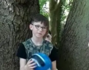 The boy behind Byrin wasn't with the family (Kennedy News and Media)