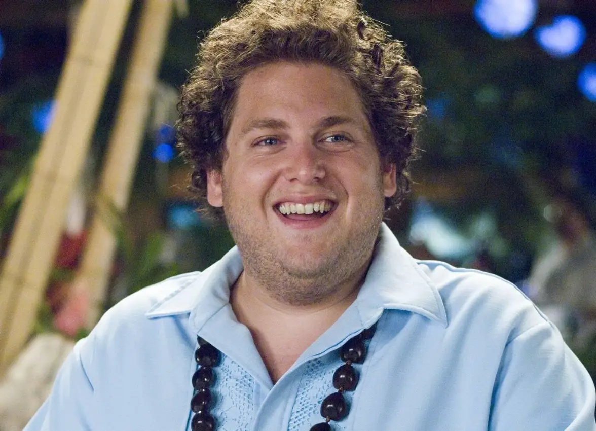 Hill plays a waiter at the resort.