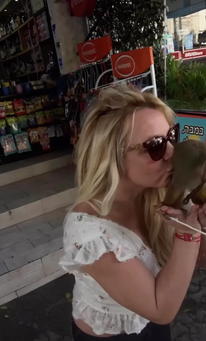 Britney Spears is on the receiving end of backlash as she posed with a monkey whilst on holiday.