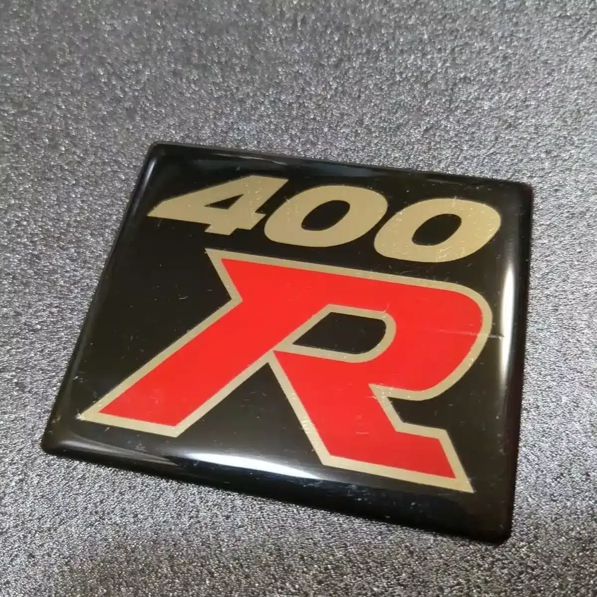 One lucky seller is hoping to fetch $40,040 on eBay for a badge from the 1997 Nissan Skyline R33 Nismo 400R (eBay)