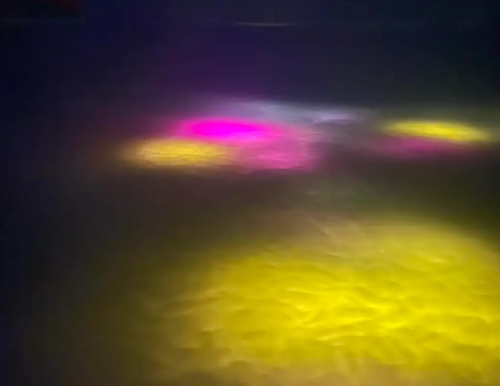 The lights were visible from the window of the plane (Facebook/Rohan Goonewardena)