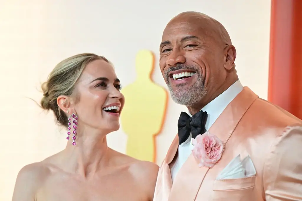 Blunt and The Rock actually have a bit of chemistry off-stage (FREDERIC J. BROWN/AFP via Getty Images)