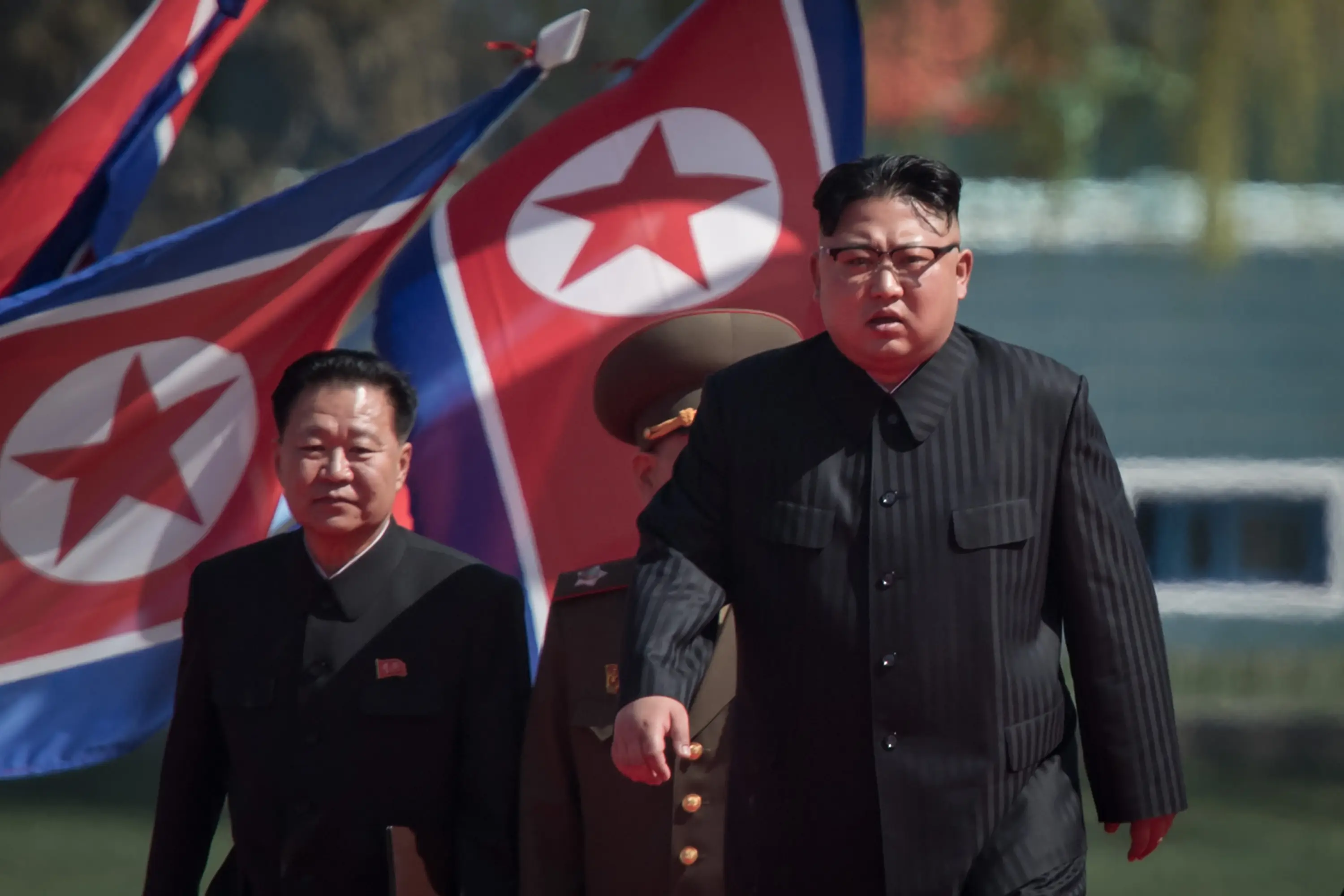 North Korea is run by Kim Jong-Un — pictured right (ED JONES/AFP via Getty Images)