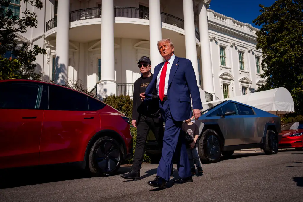 Trump and Musk outside the White House this week where several Tesla's went on display (Andrew Harnik/Getty Images)