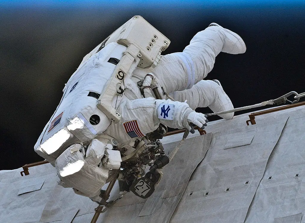 NASA astronaut Garrett Reisman dons a New York Yankee logo on his forearm during a seven-hour-25-minute spacewalk in 2010. (NASA via Getty Images)