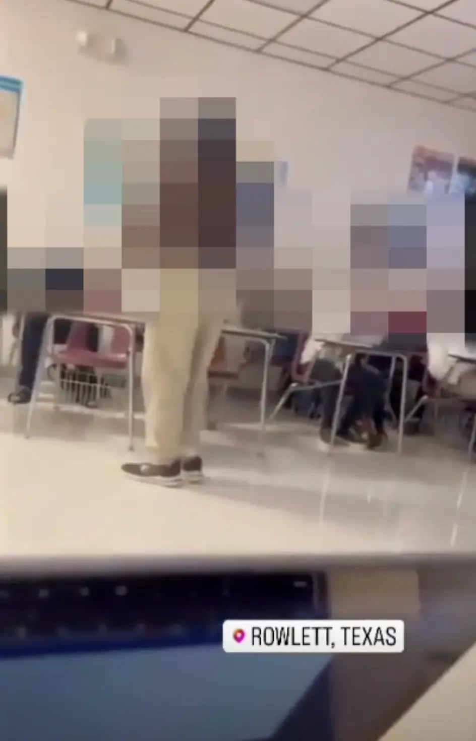 In the video, the teacher can be seen throwing a chair.