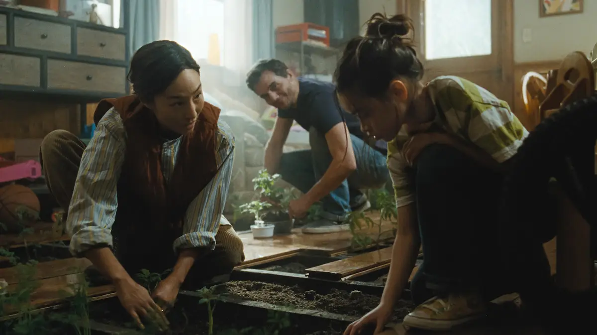 The Last House stars Greta Lee and Wagner Moura as parents trying to keep their family safe while trapped inside their own home. (Netflix)
