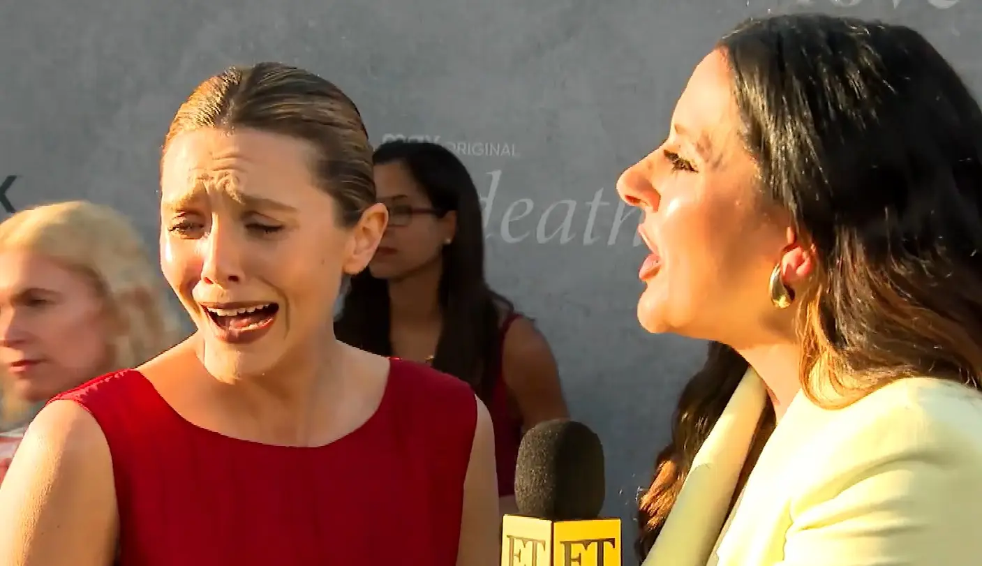 Elizabeth Olsen is laughing, not crying in this picture, but she's not too keen on the internet's nickname for her.