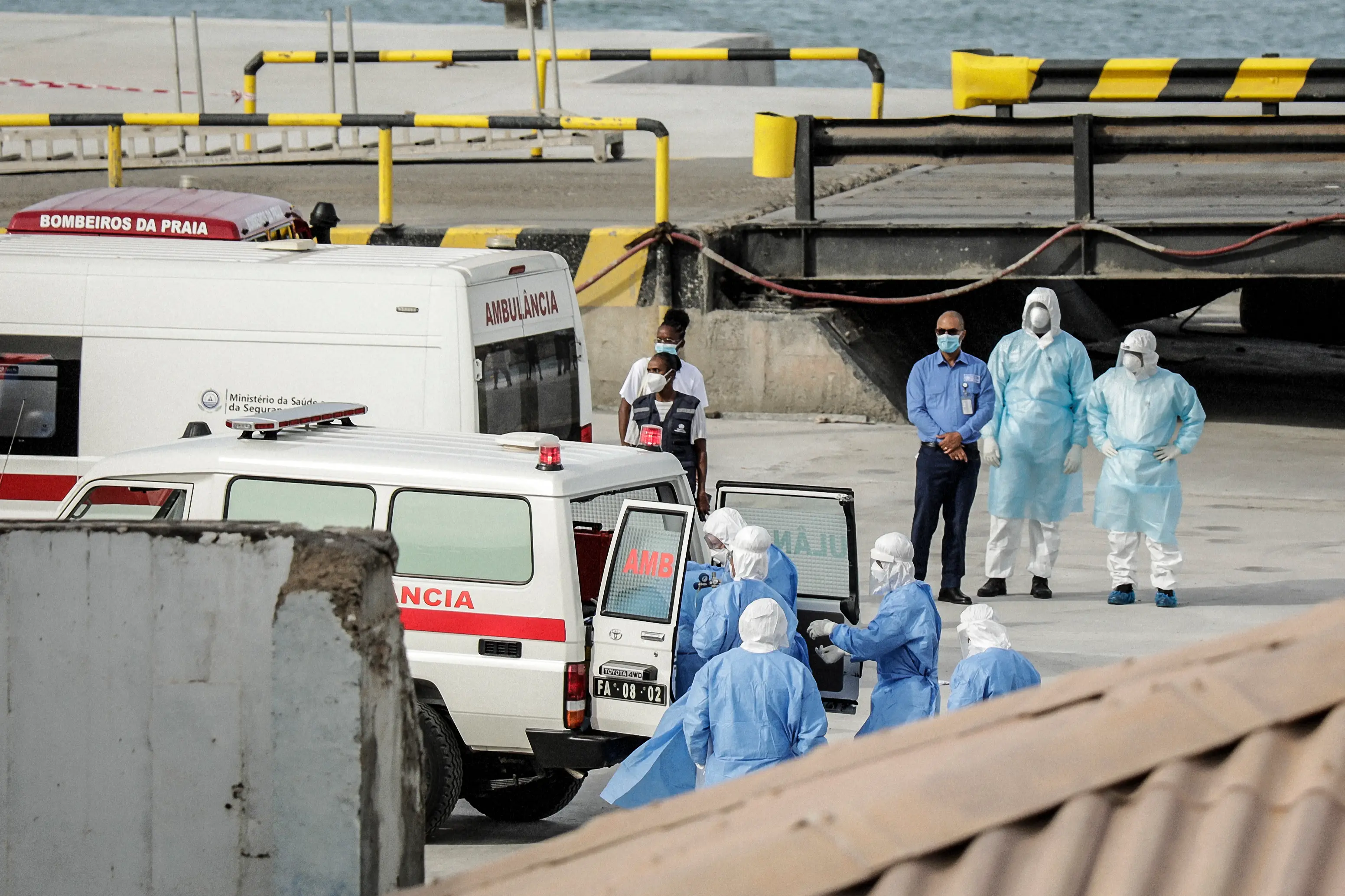 Health personnel who have been onboard the ship had to wear hazmat suits (AFP via Getty Images)