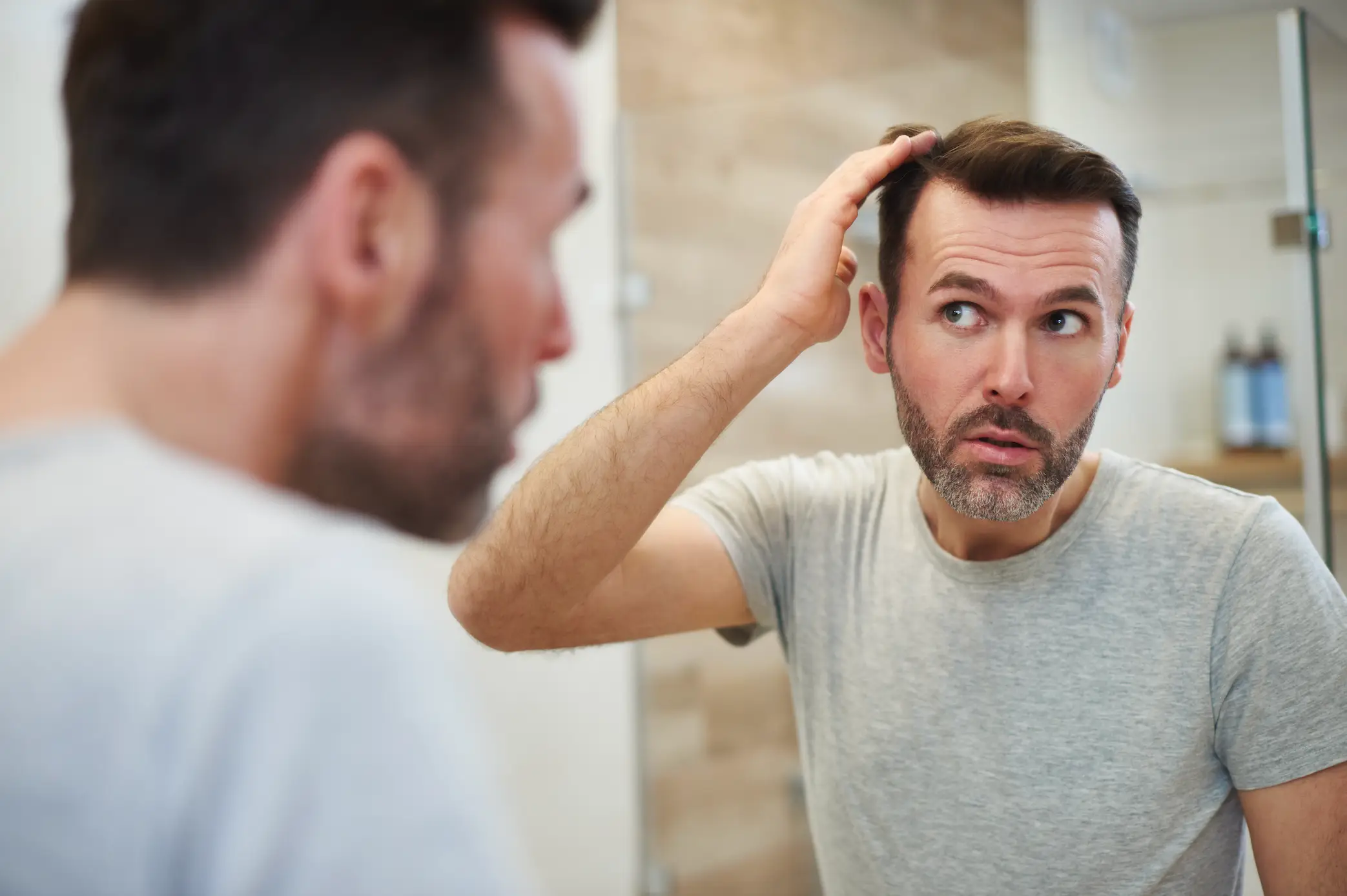Energy drinks and sodas could be increasing the risk of hair loss in men(Getty Stock Image)
