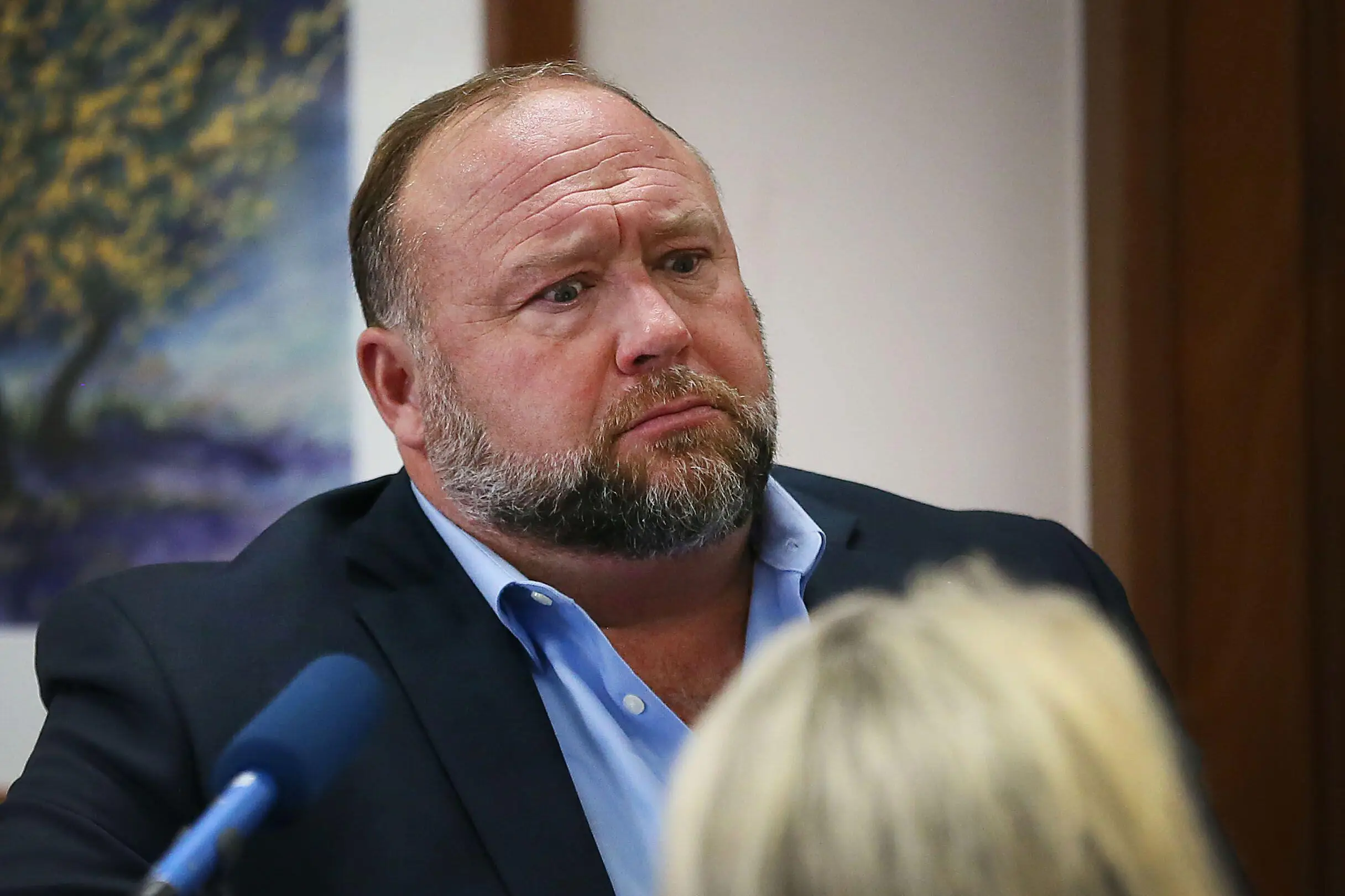 Alex Jones reacts in court.