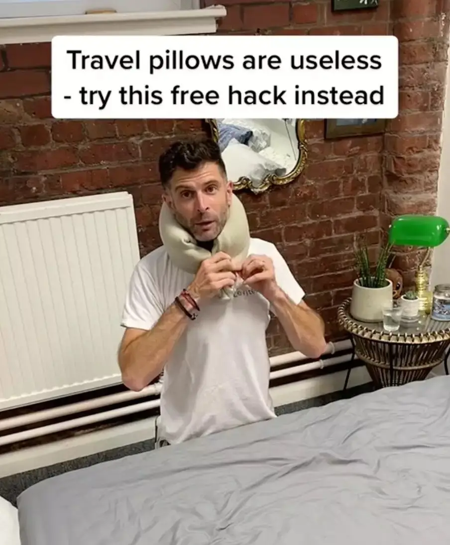 Don't waste money on travel pillows when you can just use your jumper.