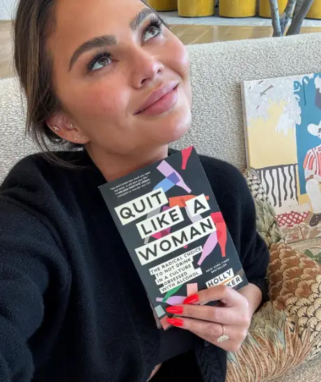 Teigen posted the admission while holding Whitaker's book (Instagram/chrissyteigen)