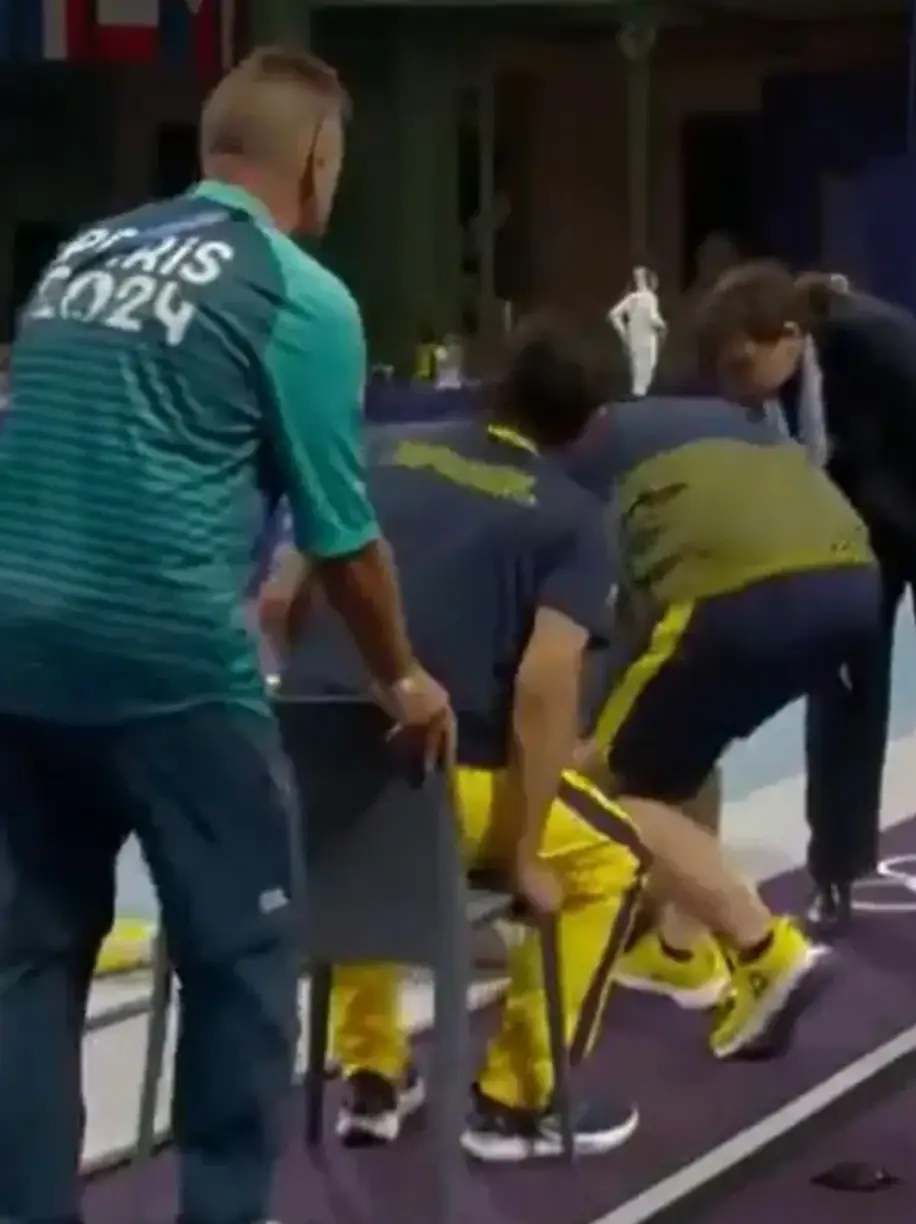 A medic sat down in a chair meant for the fencer (BBC) 