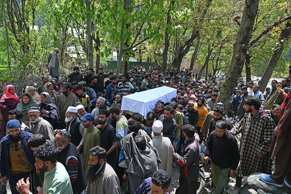 Locals carry the body of a Adil Hussain Shah, a pony rider who was among those killed in the deadly Pahalgam attack on April 23 (Waseem Andrabi/Hindustan Times via Getty Images)
