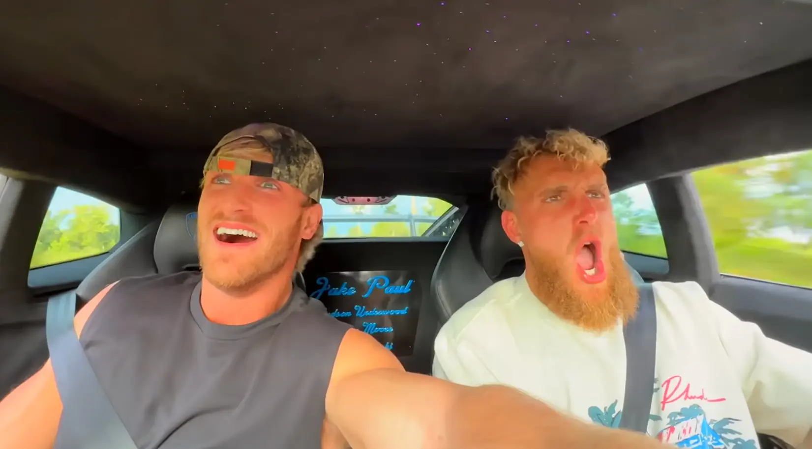 Jake and Logan Paul racing down the driveway (YouTube/Jake Paul and Paul Family Ranch)