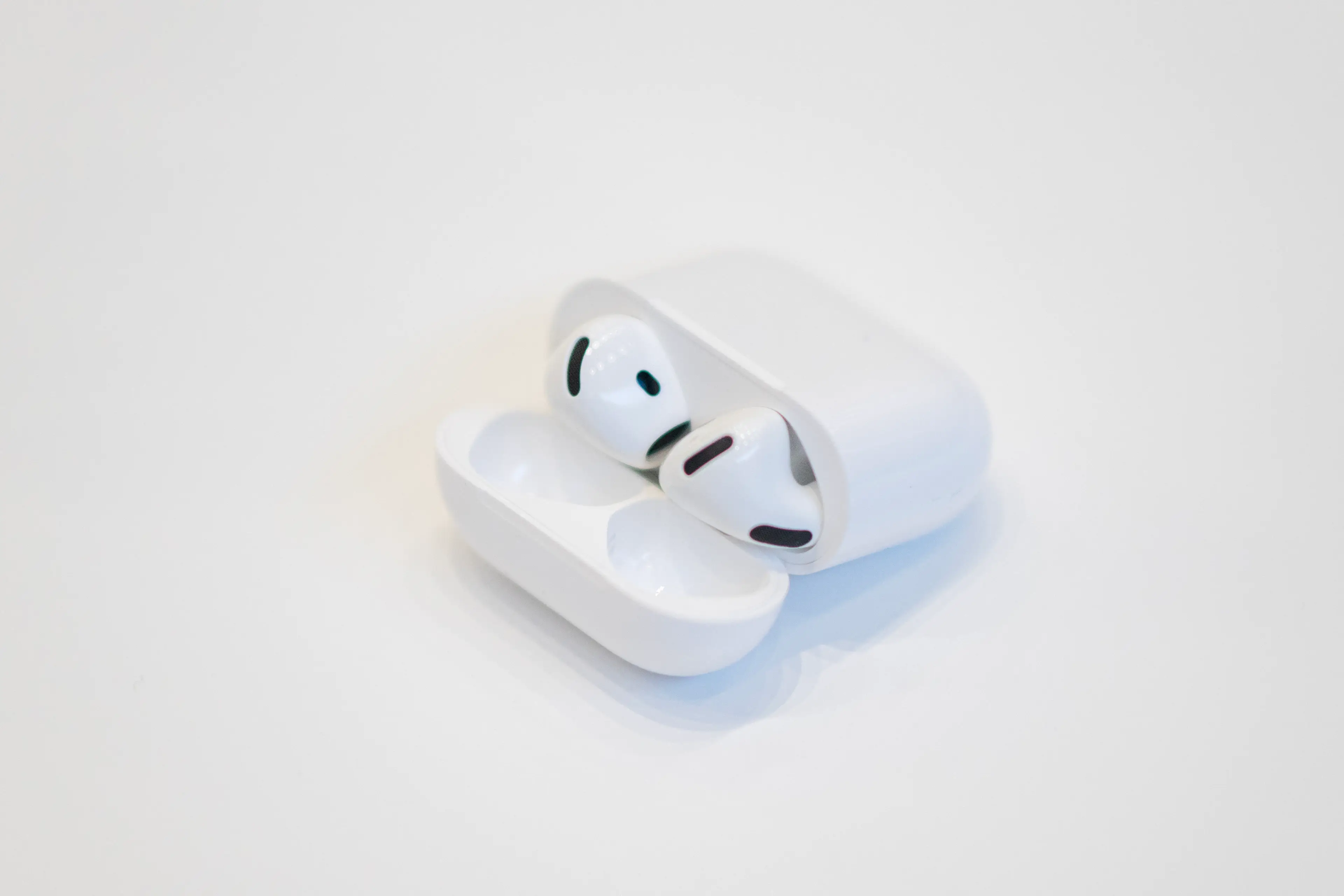 Apple's AirPods 4 may look the same as the rest but they come with some new features (NIC COURY/AFP via Getty Images) 