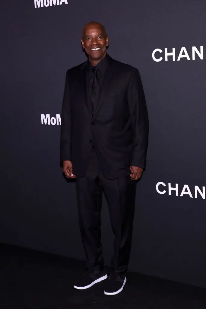 The 69-year-old was able to put the row with the autograph hunters behind him as he smiled for pictures on the red carpet (Arturo Holmes/Getty Images)