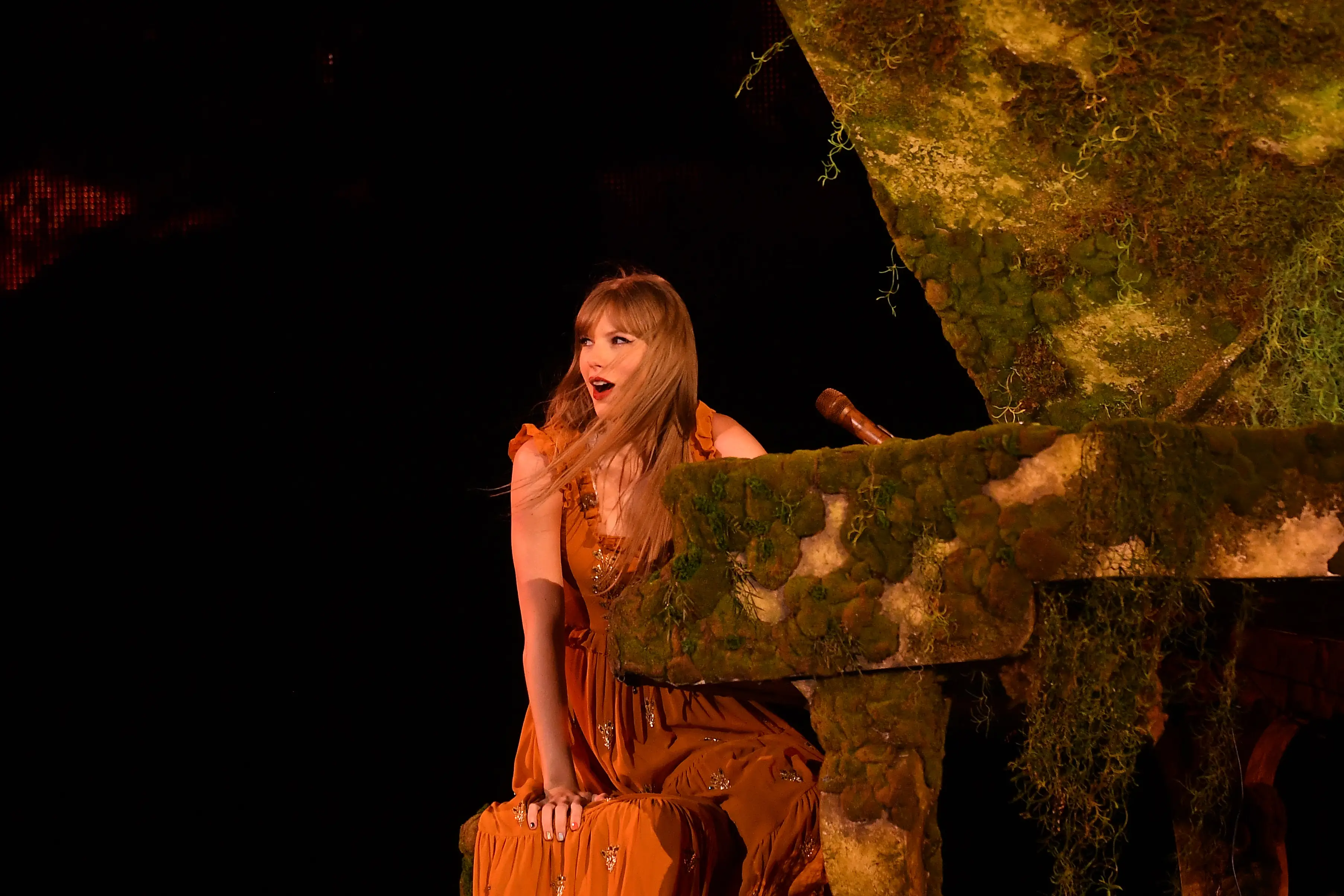 Taylor Swift asked fans to stop throwing presents on stage.