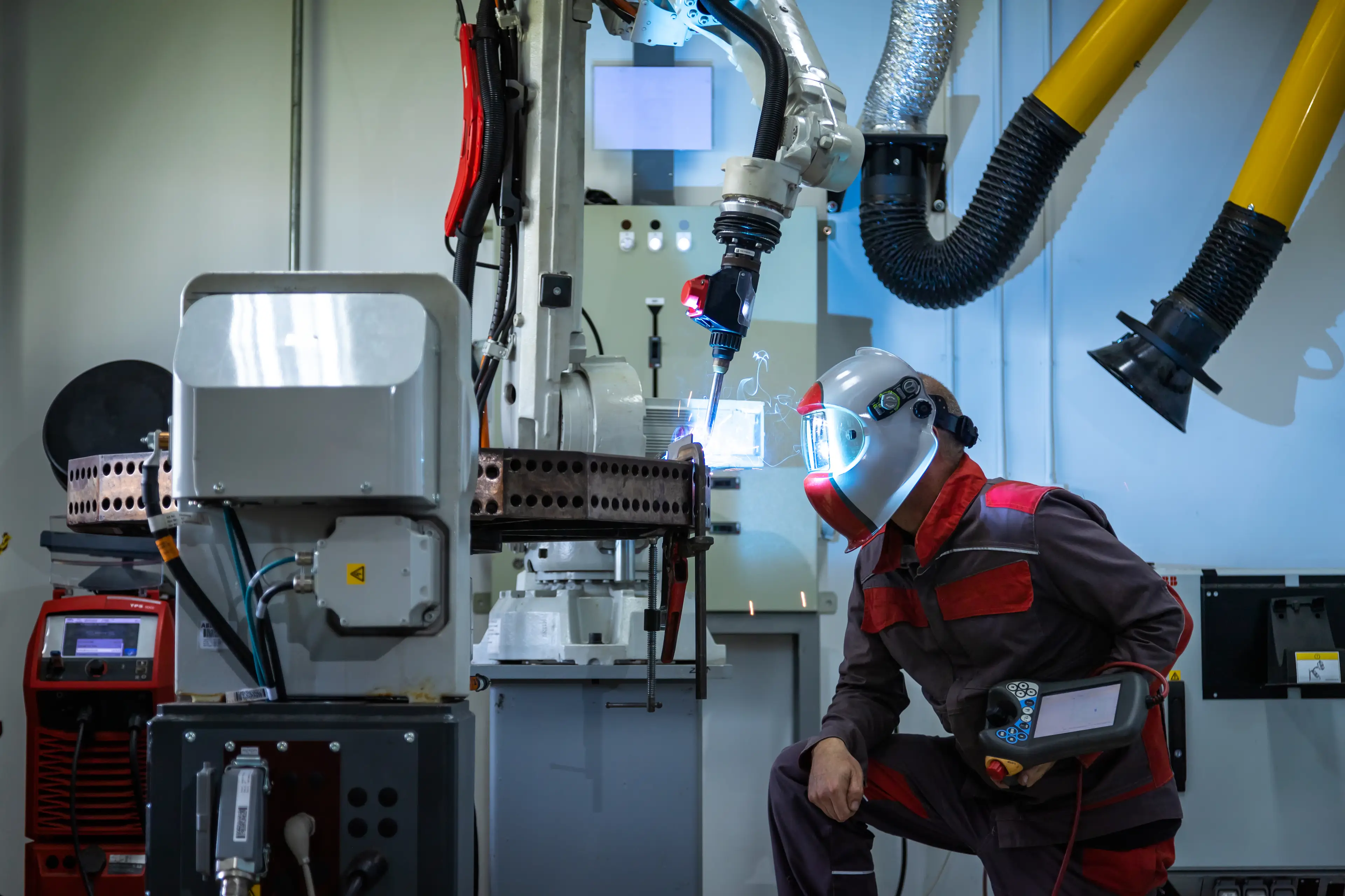 Robots are widely used in factory processes, but they would struggle to fix your temperamental air conditioning unit (Getty Stock)
