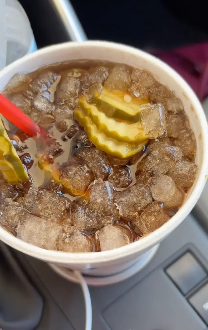 Yep, that's pickles floating in the Dr Pepper. (TikTok/@mississippimemaw)