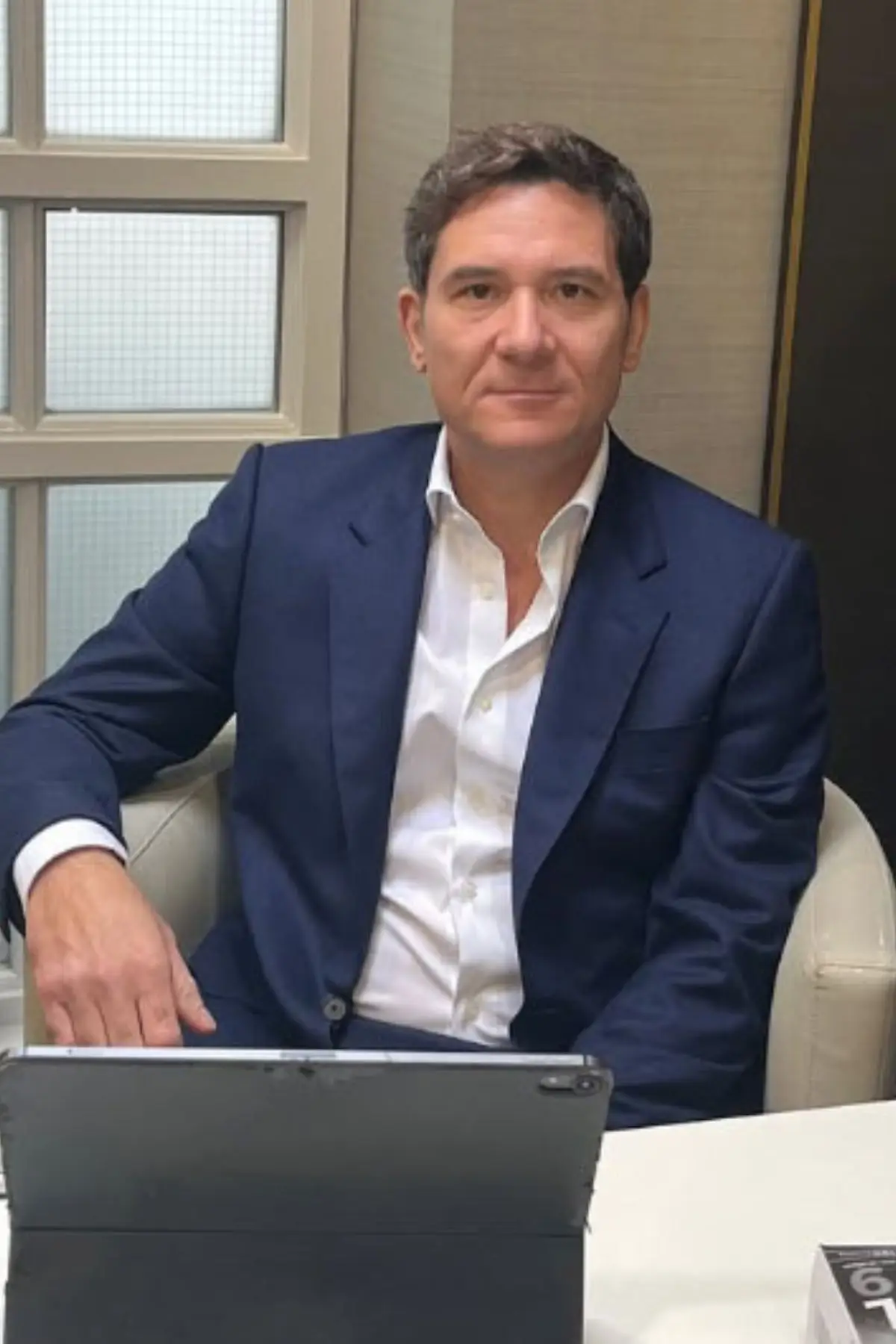 Dr Mileto is denying claims he inserted 'oversized' breast implants in his client (Champion News)