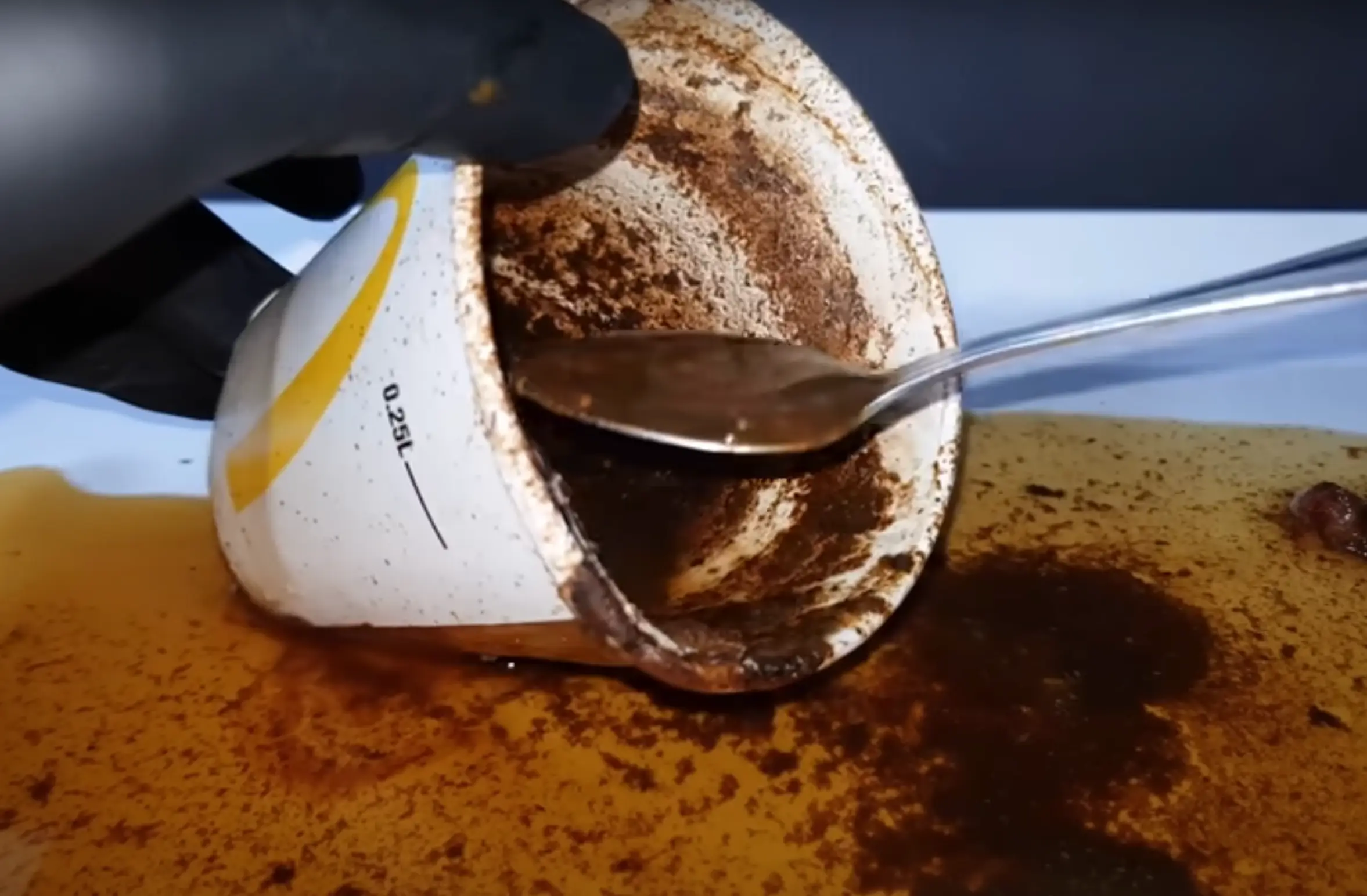 Five days go by and the water and pepsi appear fine but the orange juice quickly starts to sprout some mold. (PhotoOwl via YouTube)