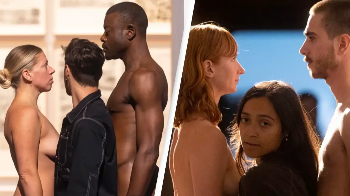 Visitors have to squeeze between nude models in order to enter new art exhibition