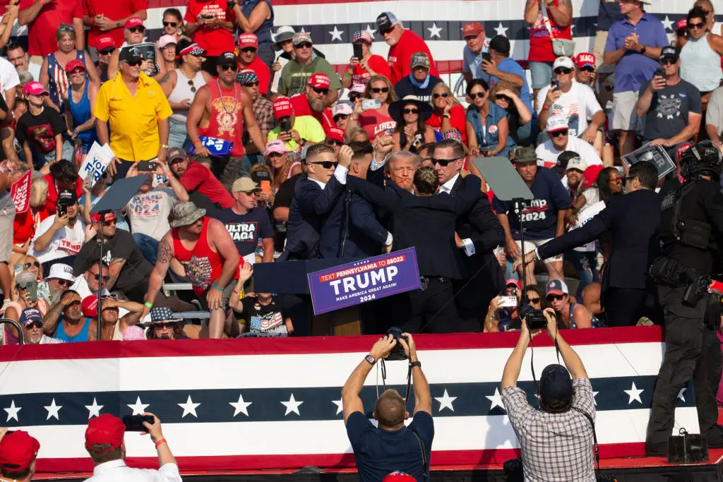 Trump was grazed on the ear before Secret Service rushed him away (REBECCA DROKE/Contributor/Getty Images)