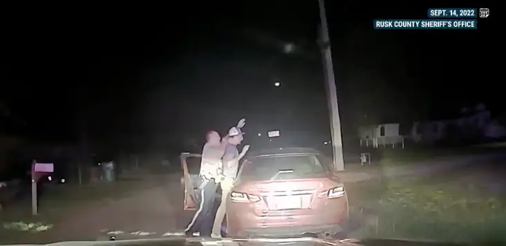 Randall could be seen complying by raising his hands before the altercation (NBC News)