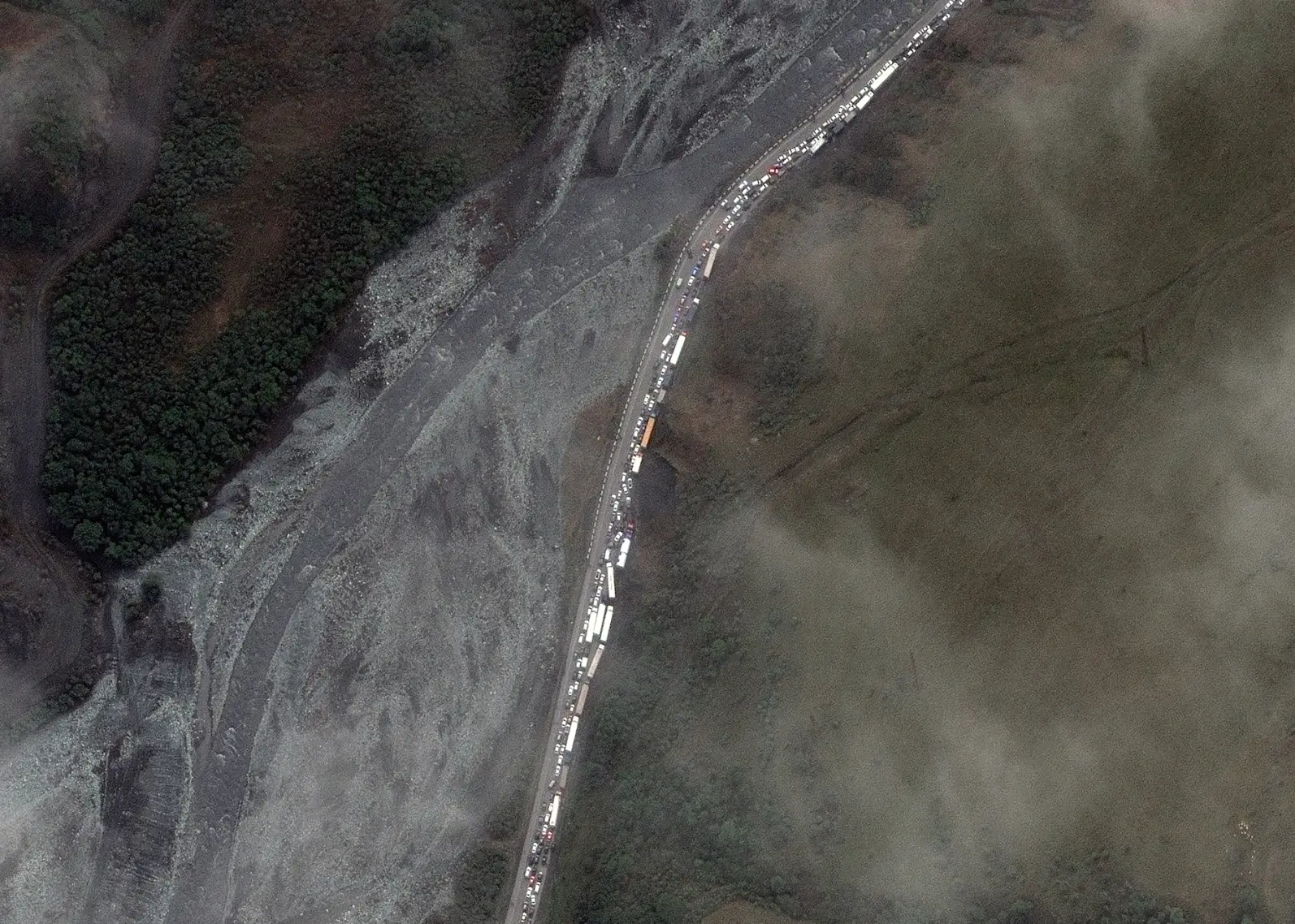 The queues stretch for miles as people look to get out of Russia.