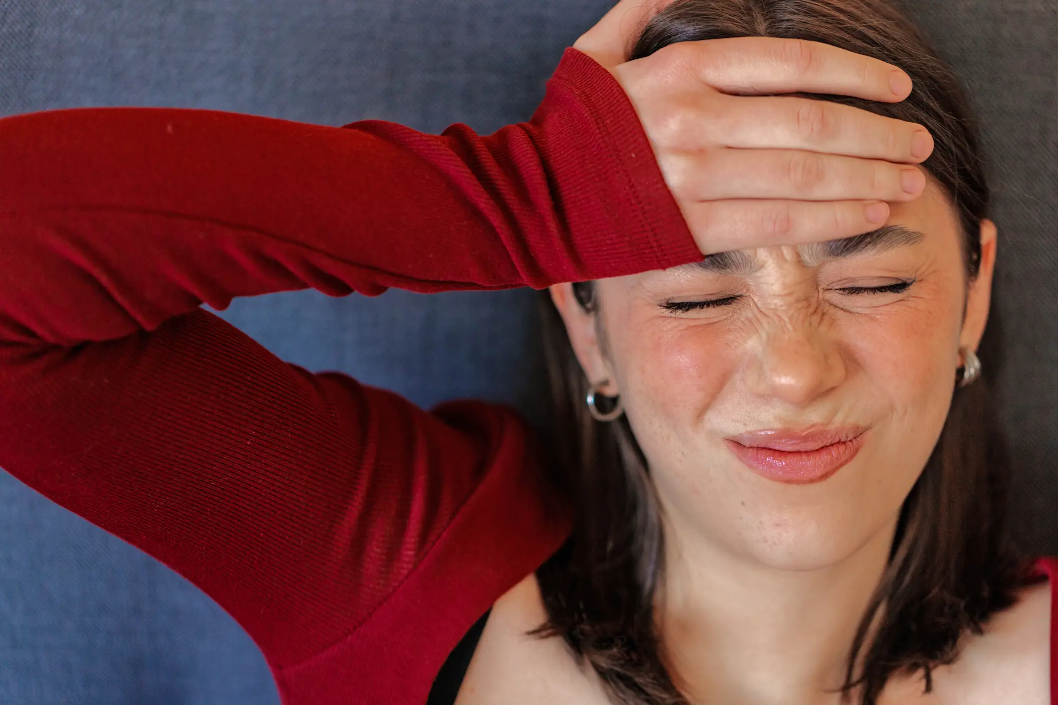 Meningitis B can cause a severe headache and a stiff neck (Getty Stock)