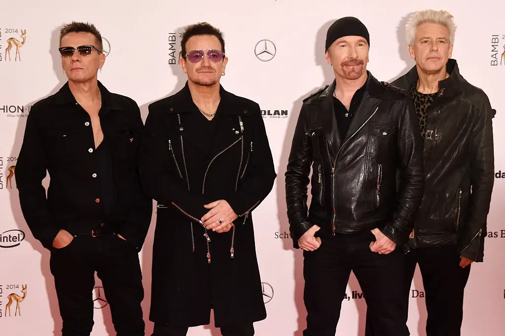 The members of the band, (L-R) Larry Mullen Jr. The Edge, Bono and Adam Clayton at the Bambi Awards in 2014 (Luca Teuchmann/Getty Images for Kryolan)
