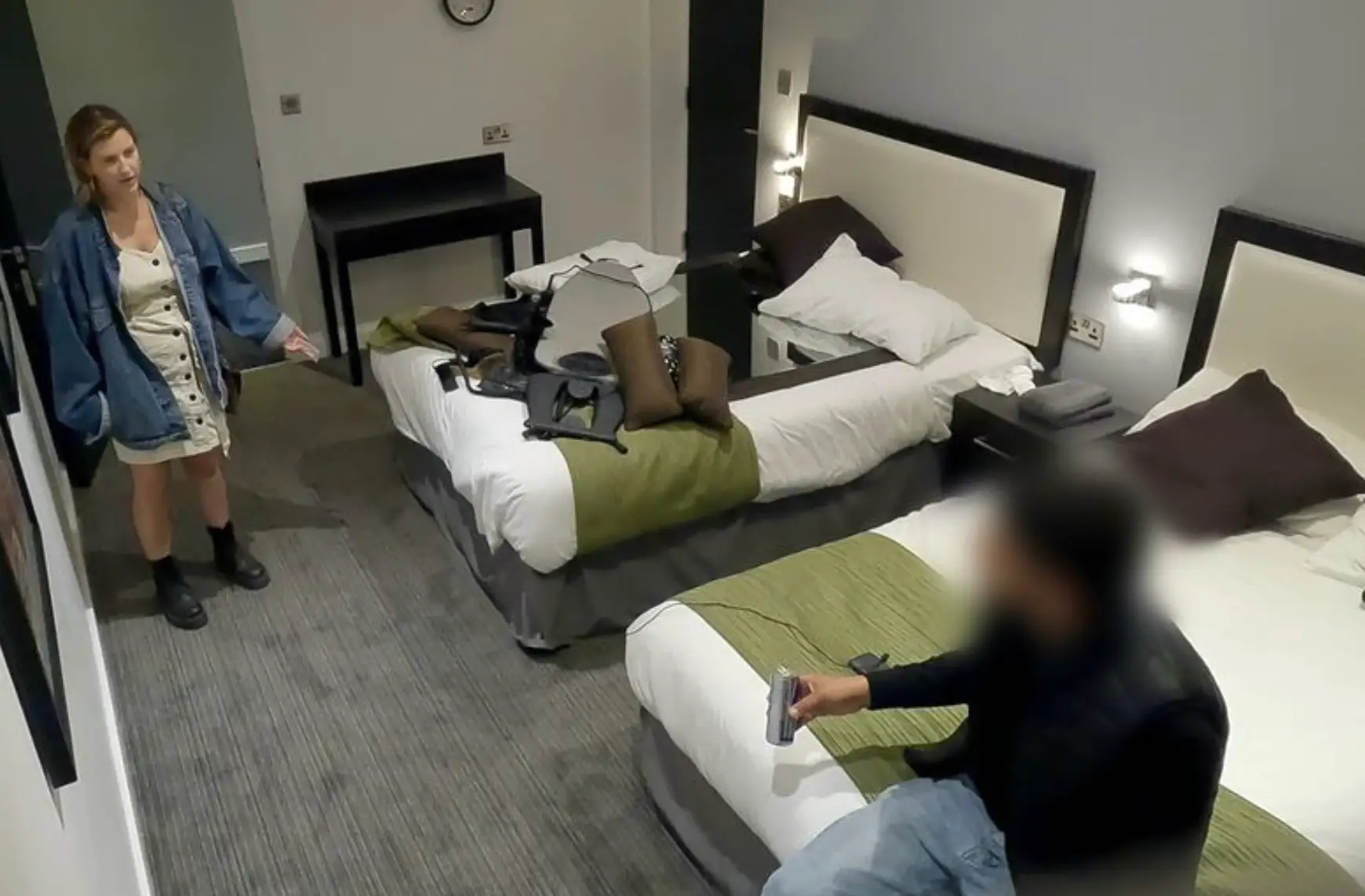 The man followed Ellie back to her hotel room.