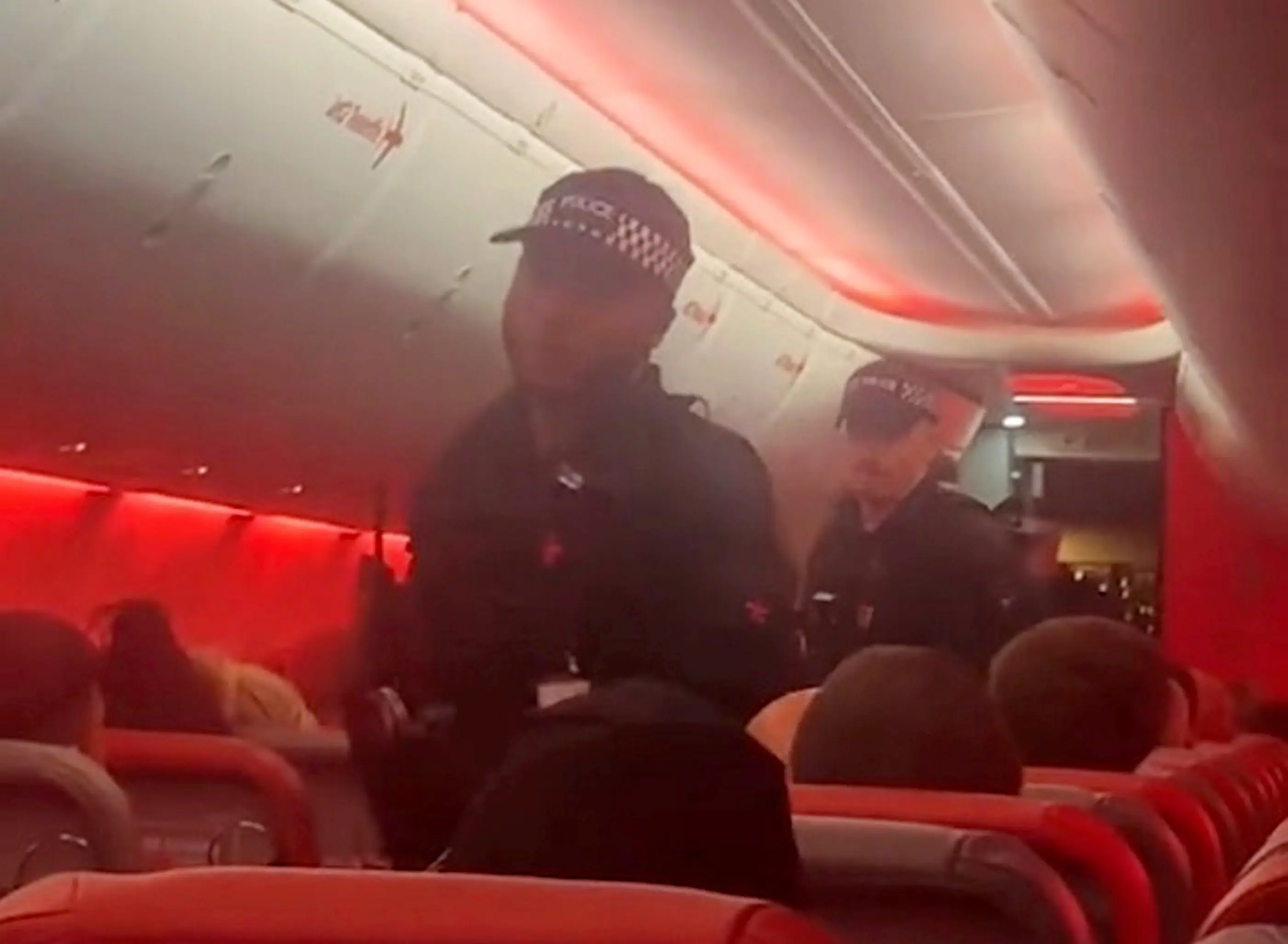 Police boarded the flight when it landed in Manchester and performed CPR on the man (SWNS)