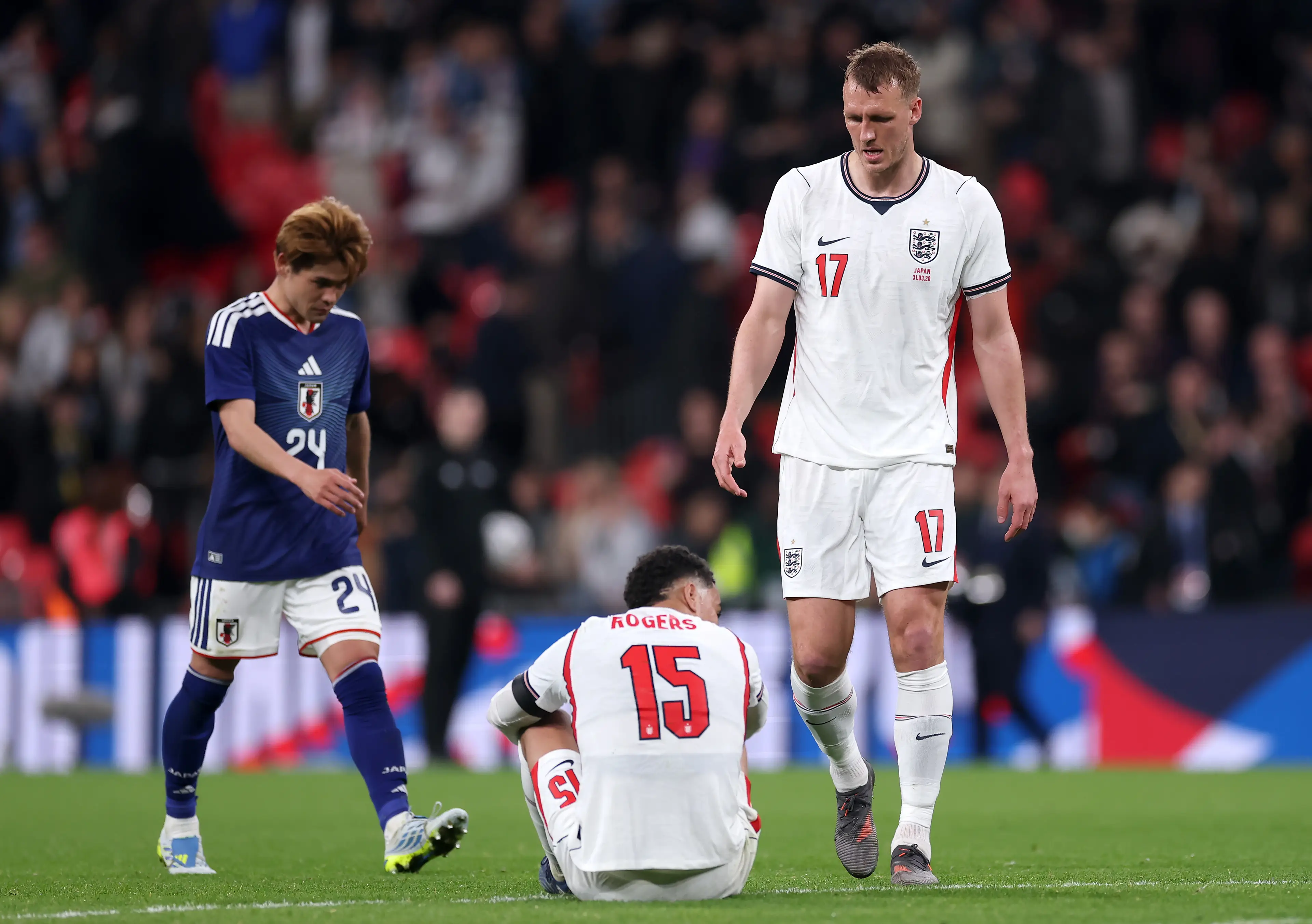 Morgan Rogers and Dan Burn look dejected during an England match. (Alex Davidson - The FA/The FA via Getty Images)