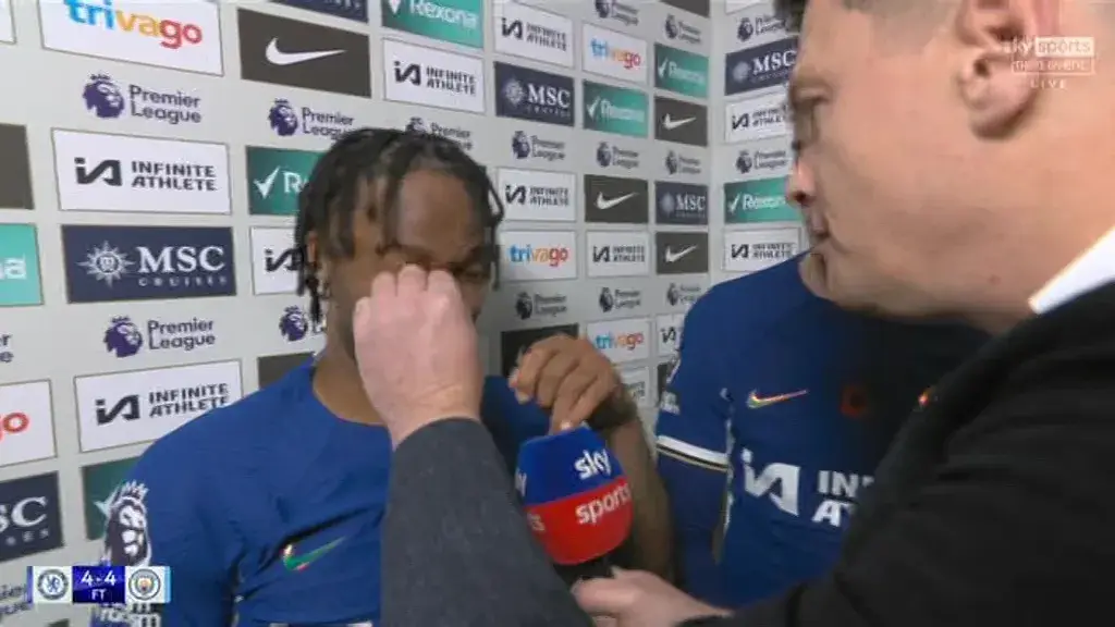 The reporter awkwardly tried to get a piece of grass out of Sterling's eye.
