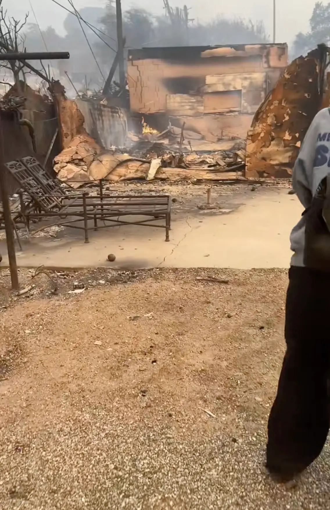 Parts of the property were still smouldering when Anderson arrived (TikTok/@saraandcrew)