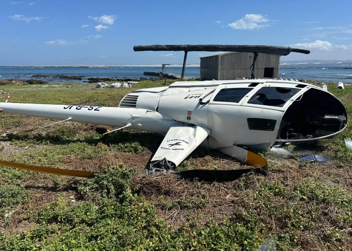 The helicopter was damaged but the people - and the penguin - were uninjured. (South African Civil Aviation Authority)
