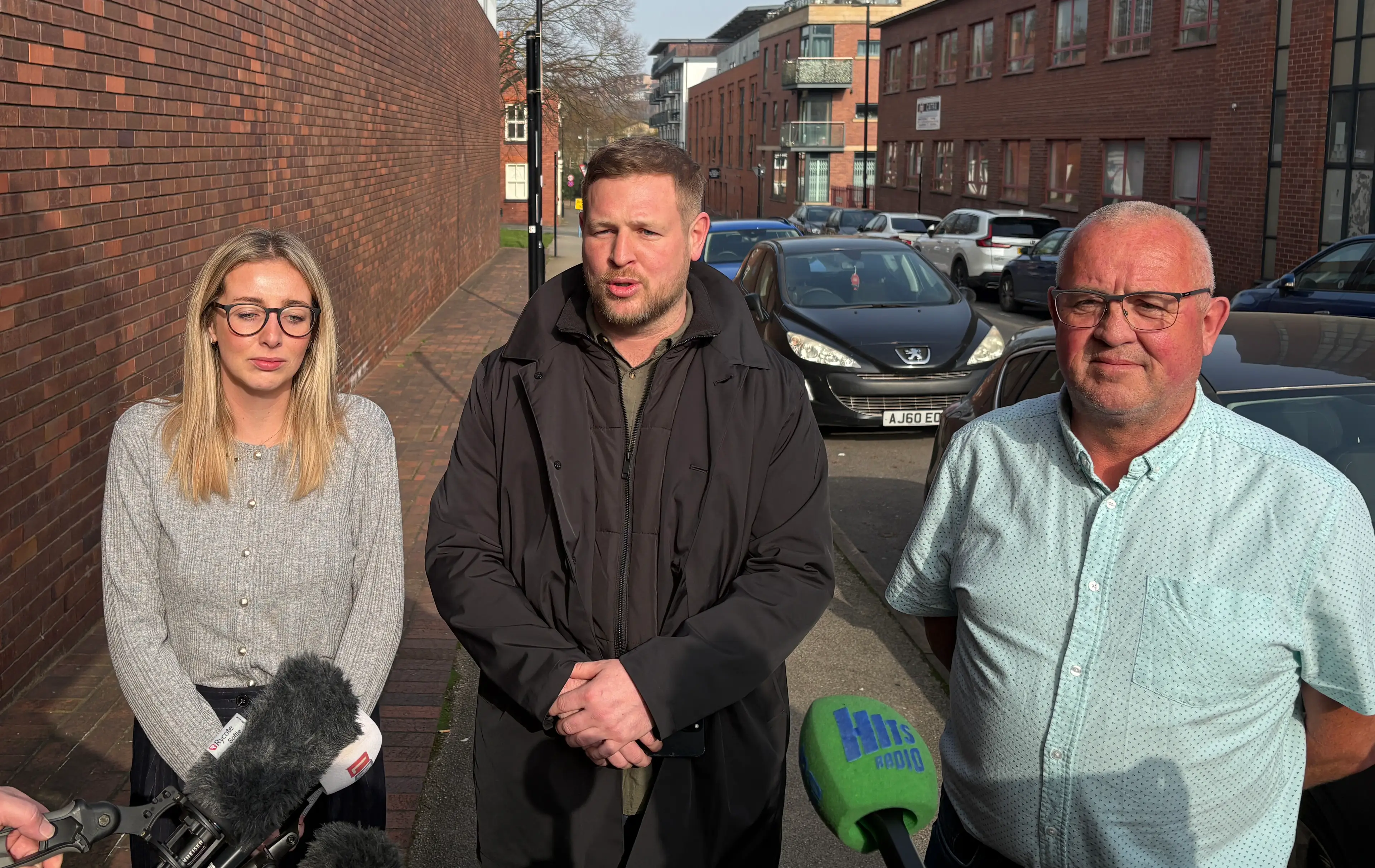 Yvonne Ford family (left to right) daughter Robyn Thomson, son Adam Ford and husband Ron Ford (Dave Higgens/PA Wire)