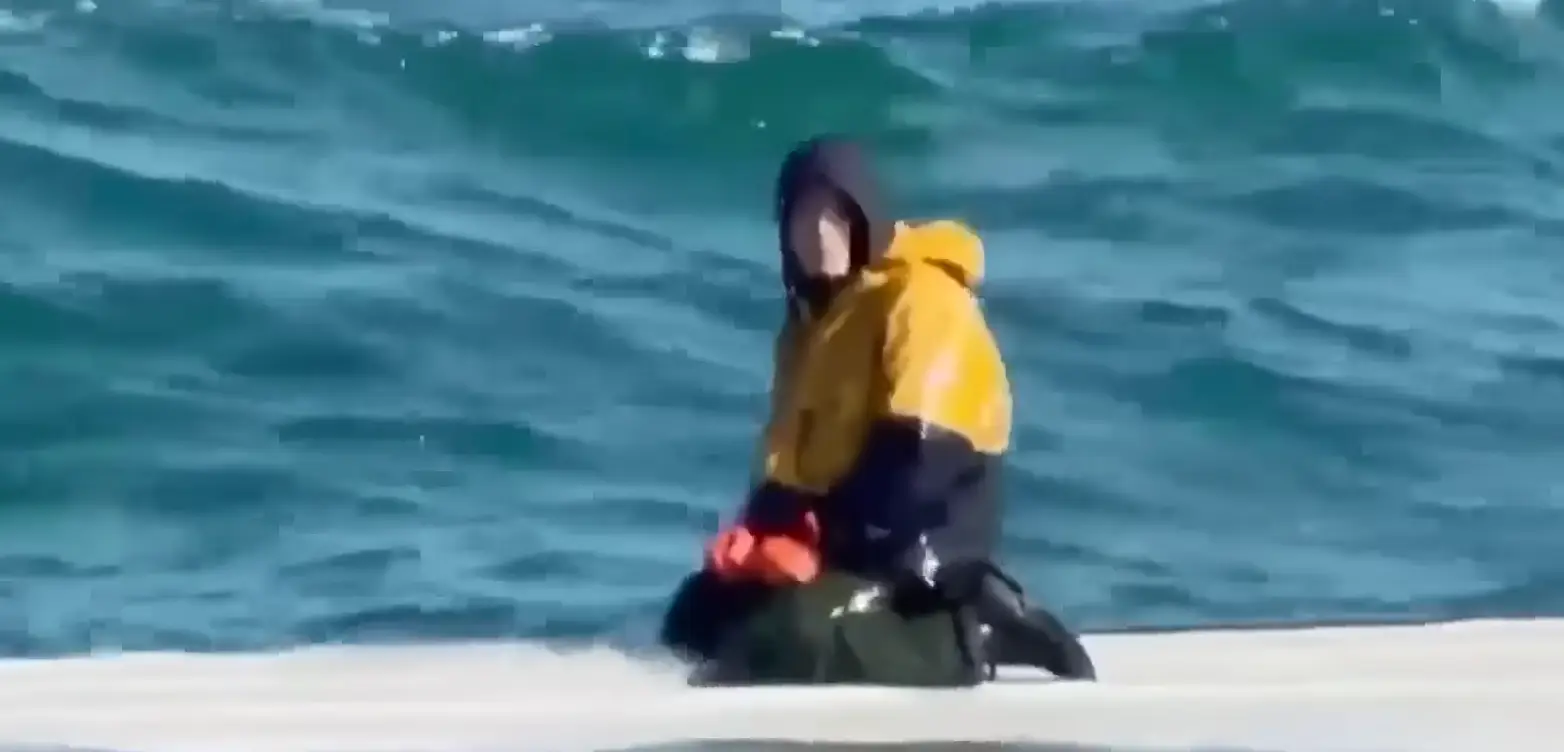 The 15-year-old was stranded on top of the boat (NBC News/ YouTube)